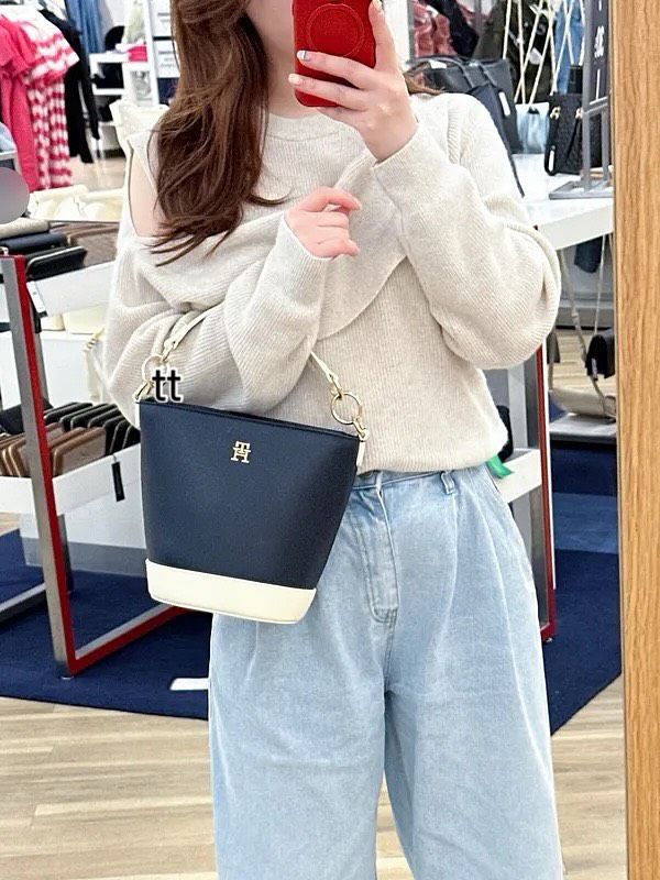 Elevate your everyday style with the Tommy Hilfiger Navy & White Bucket Bag